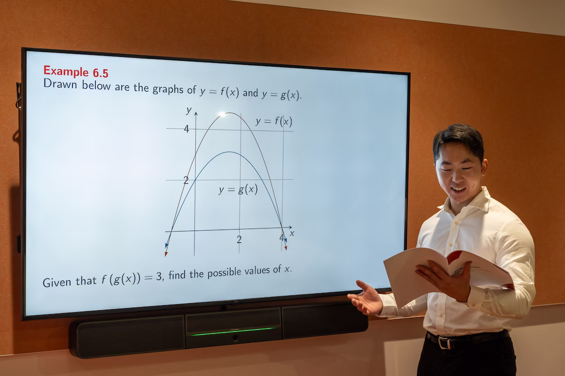 Our founder Vincent Ruan teaching students from a smartboard.
